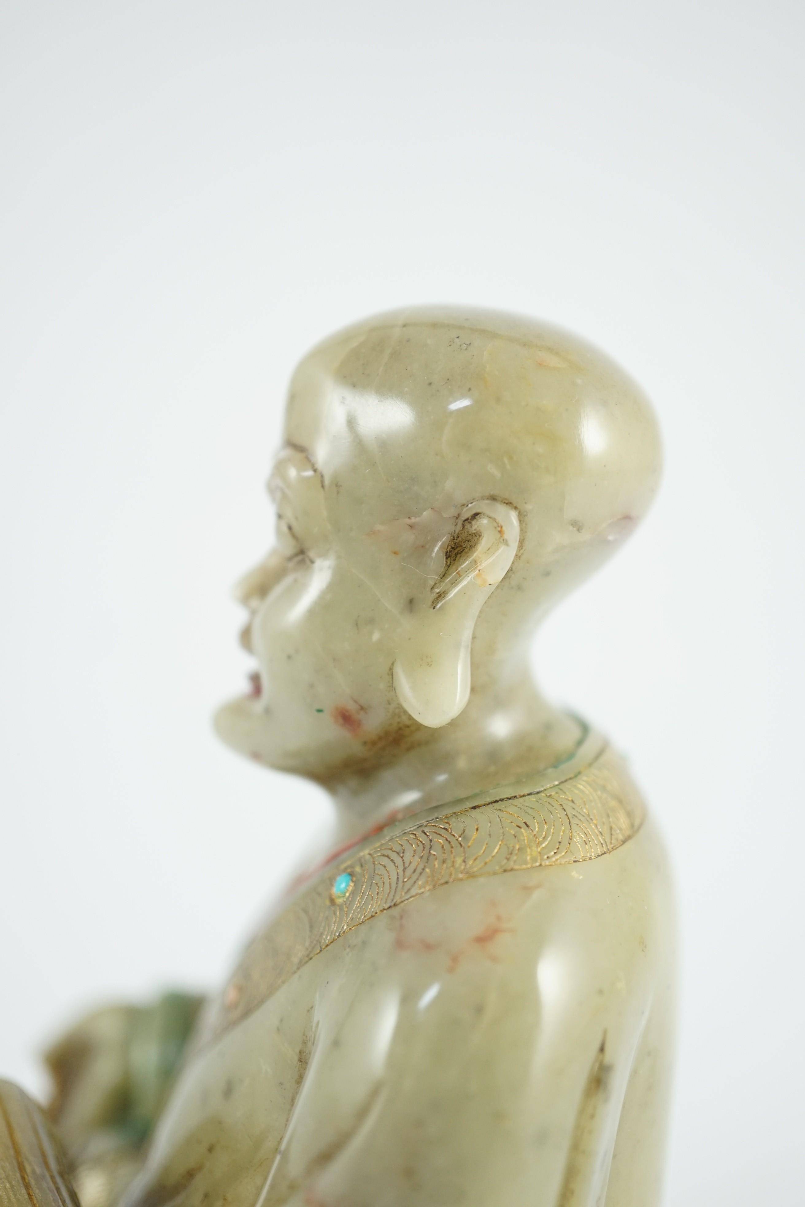 A Chinese soapstone seated figure of a luohan, 18th century, 12.5cm high